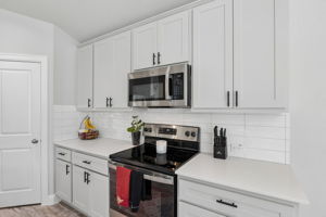 Electric range, microwave, and generous cabinet storage