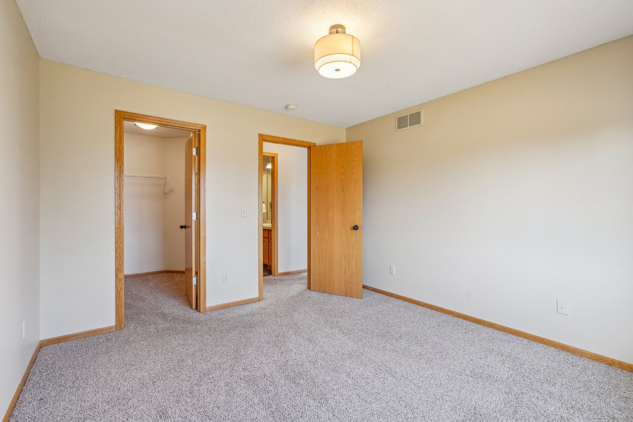 Owners Bedroom, closet and just across to the full bathroom.