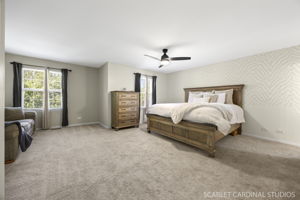 Impressively large primary suite with dedicated sitting area, generous walk-in closet, and a private en suite bath