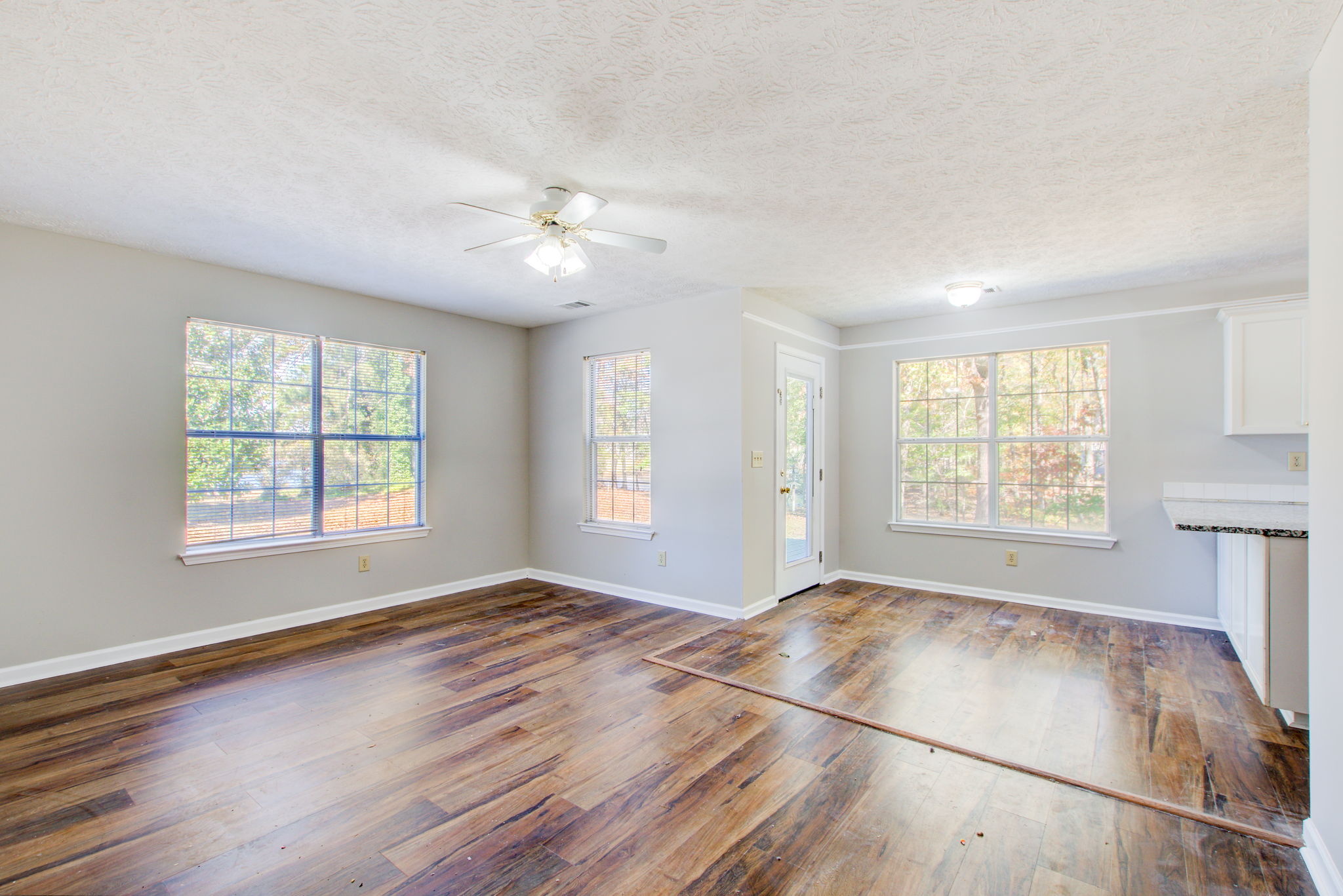 10 Family Room w Breakfast Area + Patio Walkout