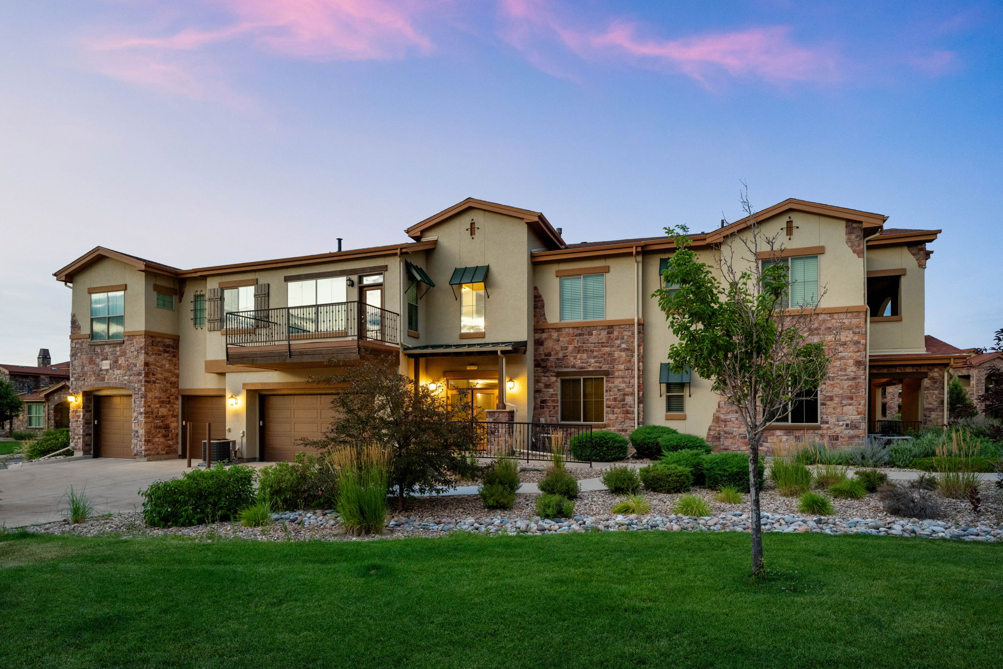 West entrance to the building with grass from the promenade in between these 2 buildings
