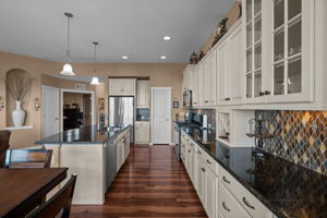 Kitchen looking back towards foyer and study/guest bedroom