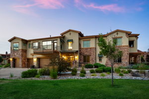 West entrance to the building with grass from the promenade in between these 2 buildings