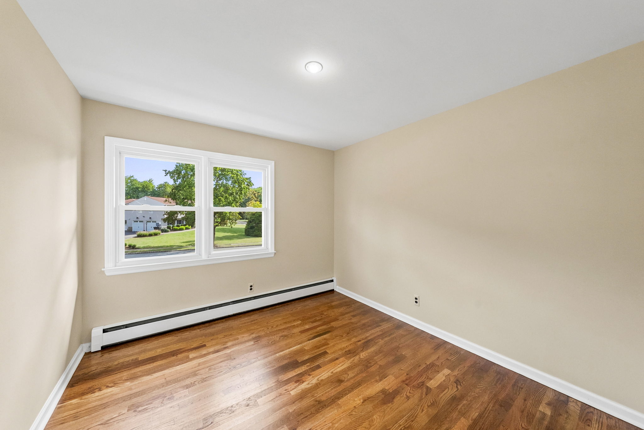 Bedroom #3-freshly painted, refinished hardwood floors +