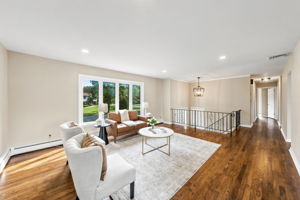 Spacious Living room; freshly painted, beautiful hardwood floors and open concept living.