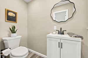 Powder Room-Ground Level; freshly painted, beautiful new laminate  floors.