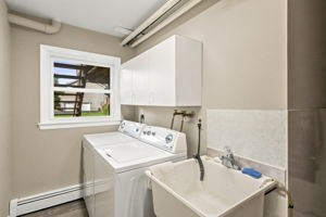 Laundry/Mud Room-Ground Level; freshly painted, beautiful new laminate  floors.