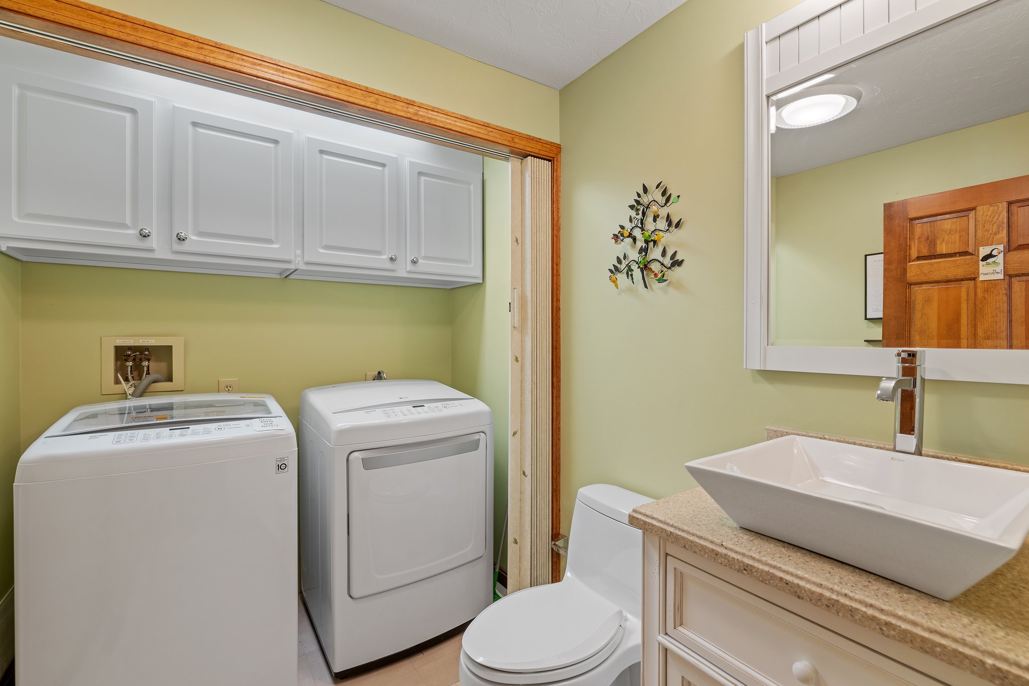Laundry in 1/2 bath by Primary BR