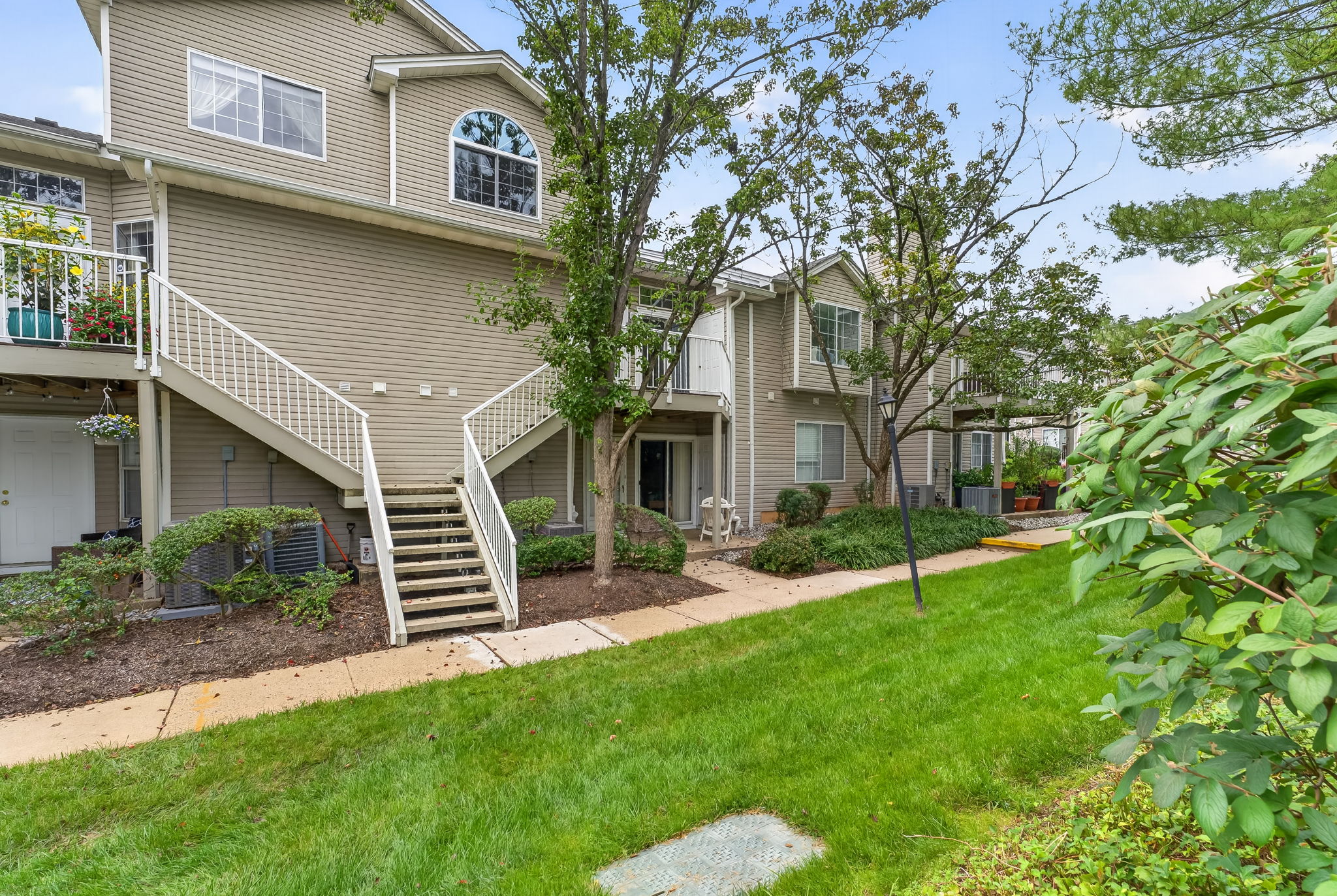 EXTERIOR PICTURE Heated steps to the front door. Glass slider leading to a private composite deck—an inviting spot for morning coffee and relaxation. Deck access to a convenient storage closet.