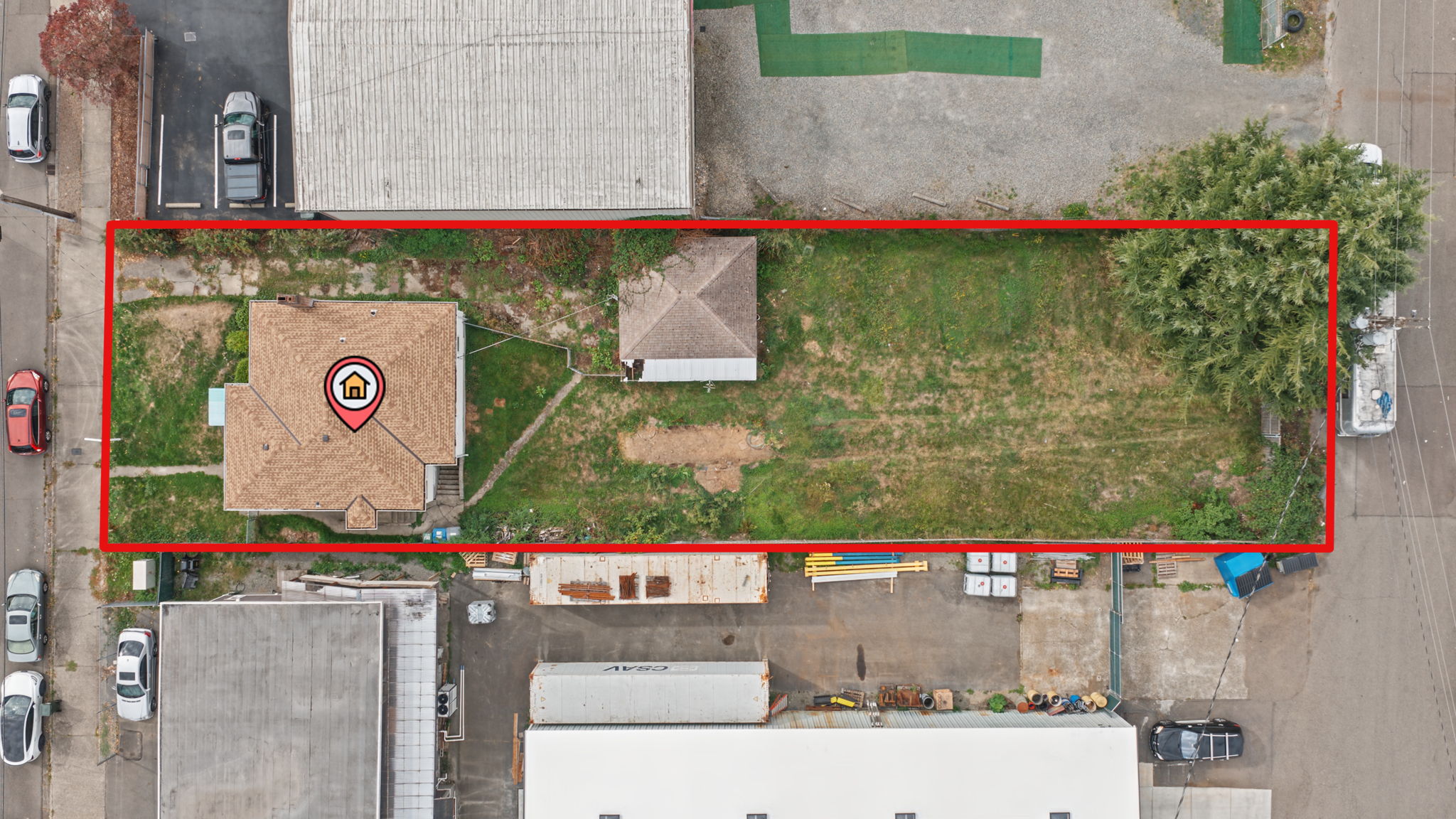 Top-down aerial view showing the 10,018 SqFt street-to-alley parcel; approximate parcel outline shown in red.