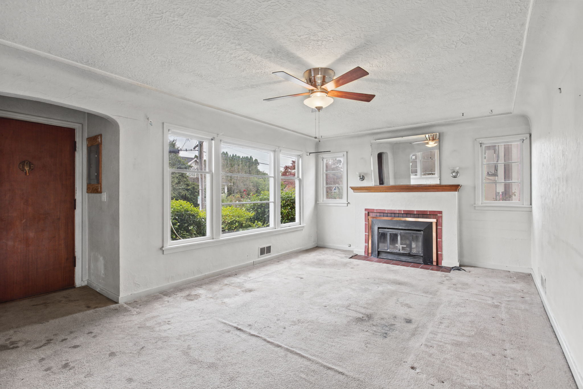 Broad windows bring strong south-facing light into the main living space.