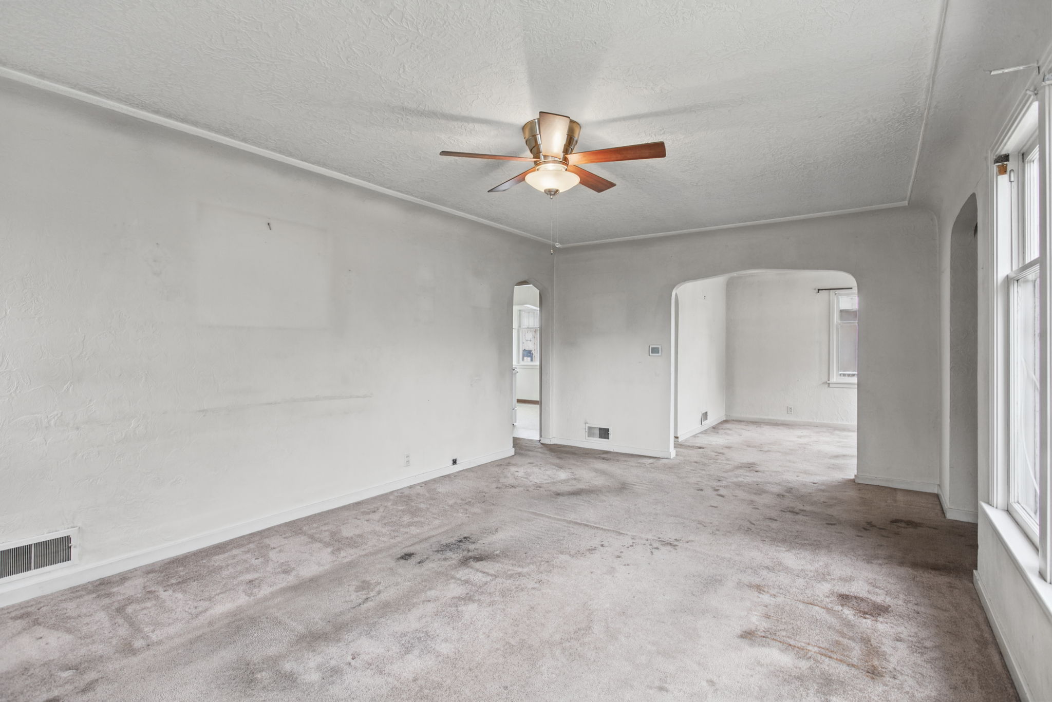 Generous living-room proportions provide a flexible starting point for renovation.