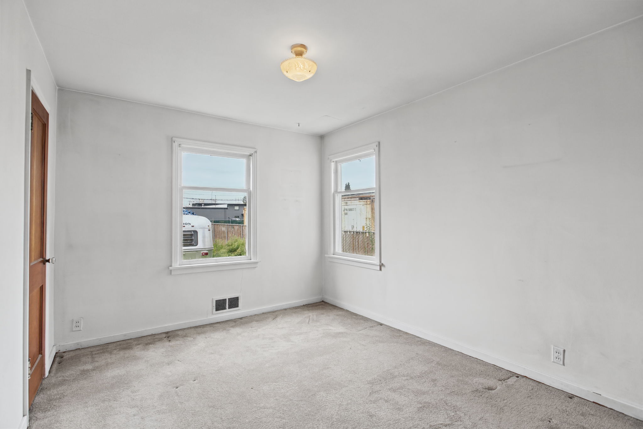 Main-floor bedroom with windows on two sides.