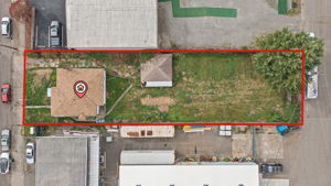 Top-down aerial view showing the 10,018 SqFt street-to-alley parcel; approximate parcel outline shown in red.