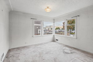 Classic 1940s corner windows bring natural light into the formal dining room.