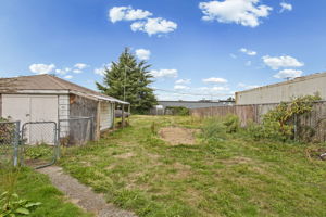 Deep rear yard highlights the scale of the 10,018 SqFt street-to-alley lot and rear alley access.