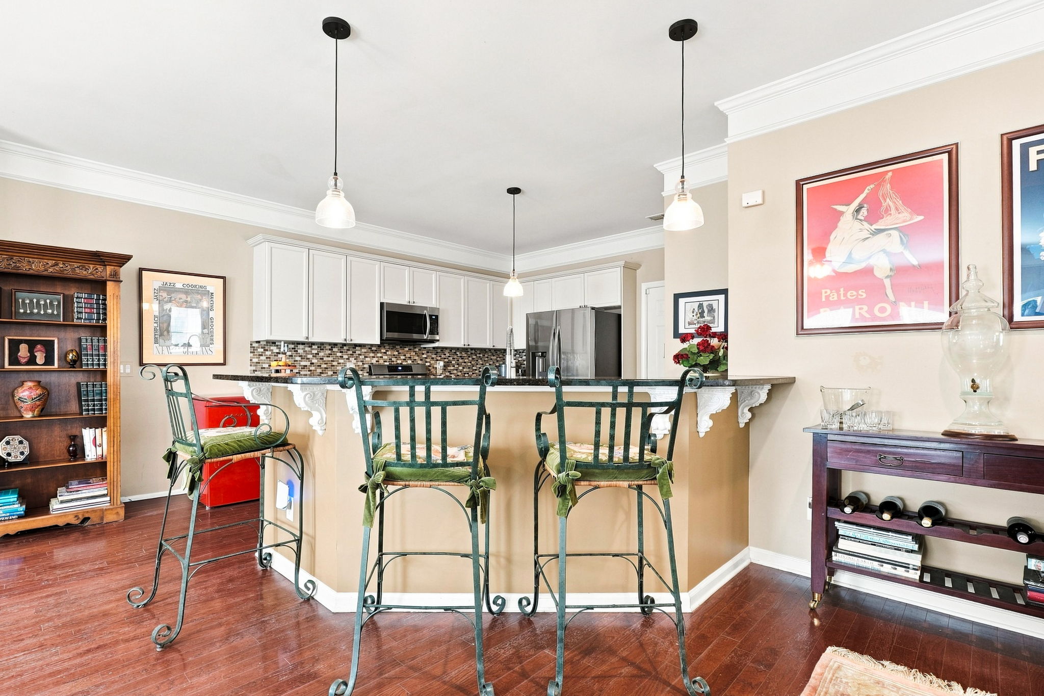 Breakfast Bar overlooks the kitchen with loads of cabinets