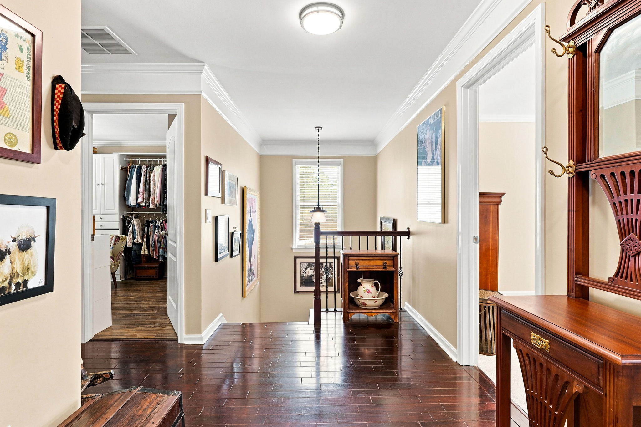 Looking toward two of the four bedrooms.  Let's enter the door on the right of the hall stand