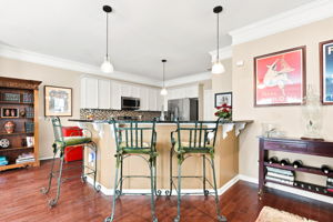 Breakfast Bar overlooks the kitchen with loads of cabinets