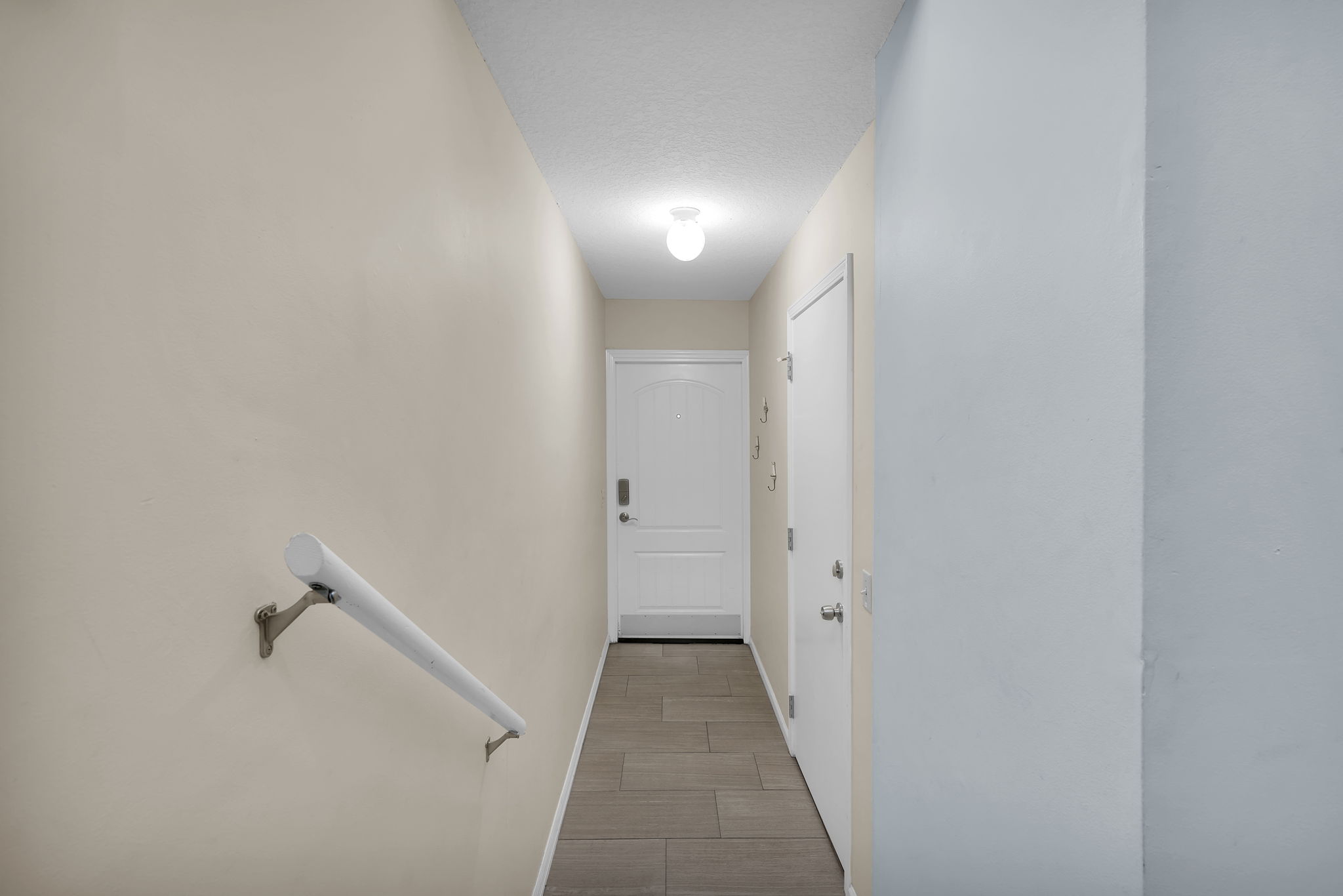 Front door to 1st floor bedroom and garage
