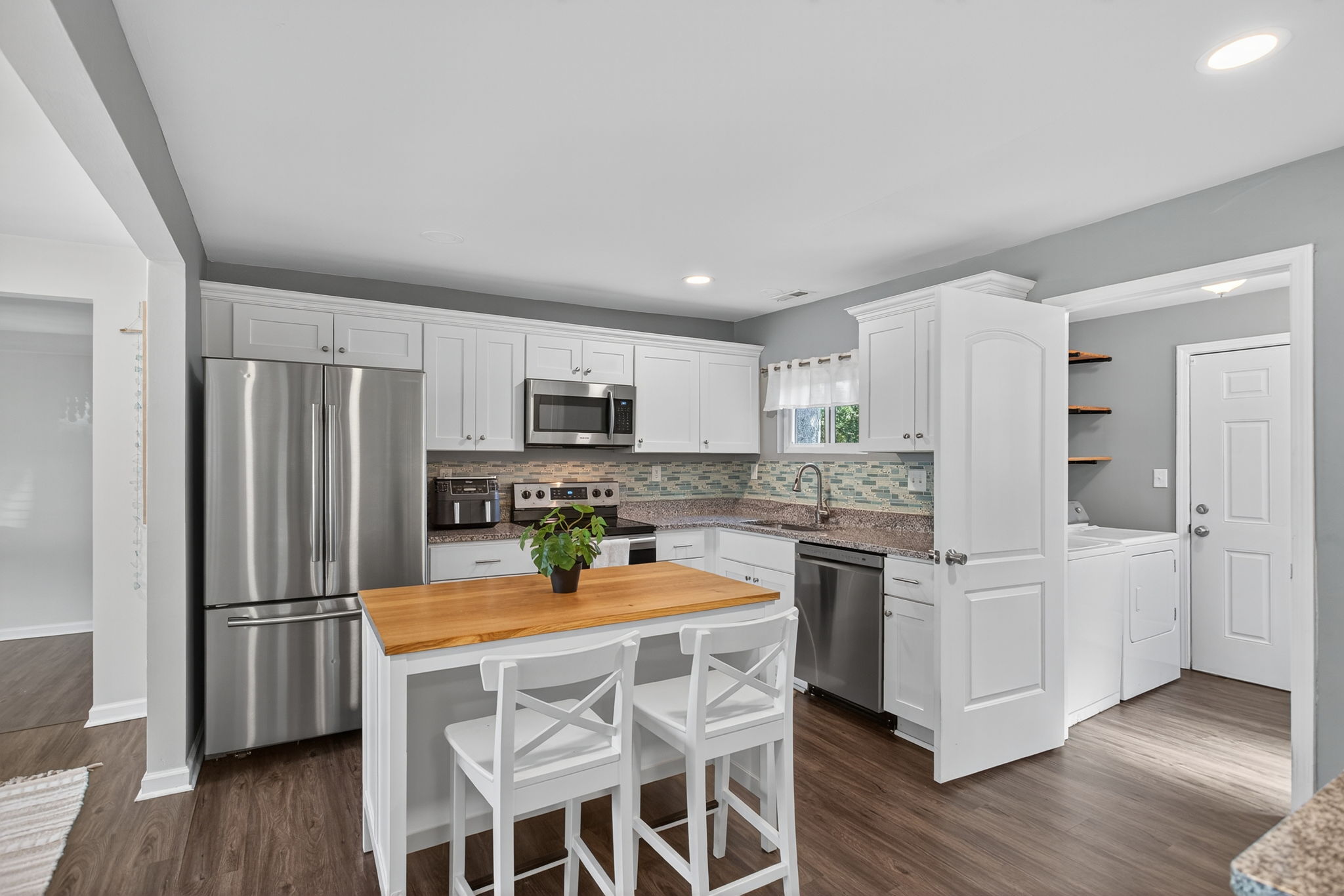 Updated kitchen with stainless steel appliances.