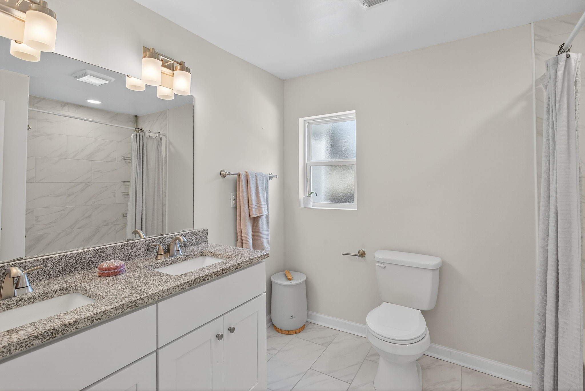 Updated hall bath with dual vanity.