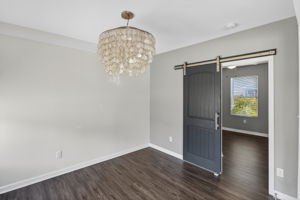 Seamless flow from dining to living and kitchen.