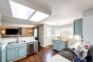 View of the Eat-in space off of the kitchen with a door leading out onto the backyard deck area!