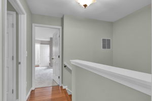 Upper level hallway with hardwood floors!