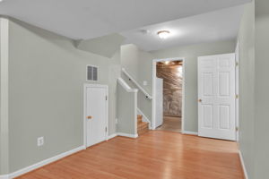 Basement with beautiful laminate flooring