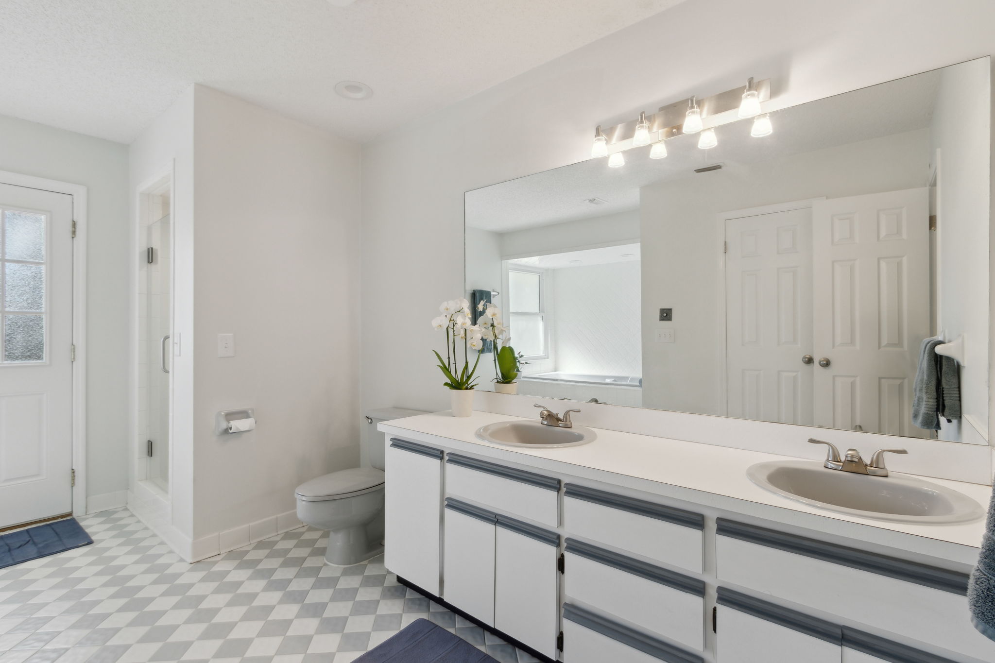 Spacious Primary Bathroom with dual sinks, separate shower and tub