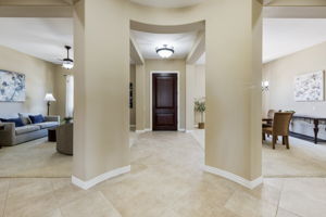 The entry hall is flanked by the formal living room and dining room.