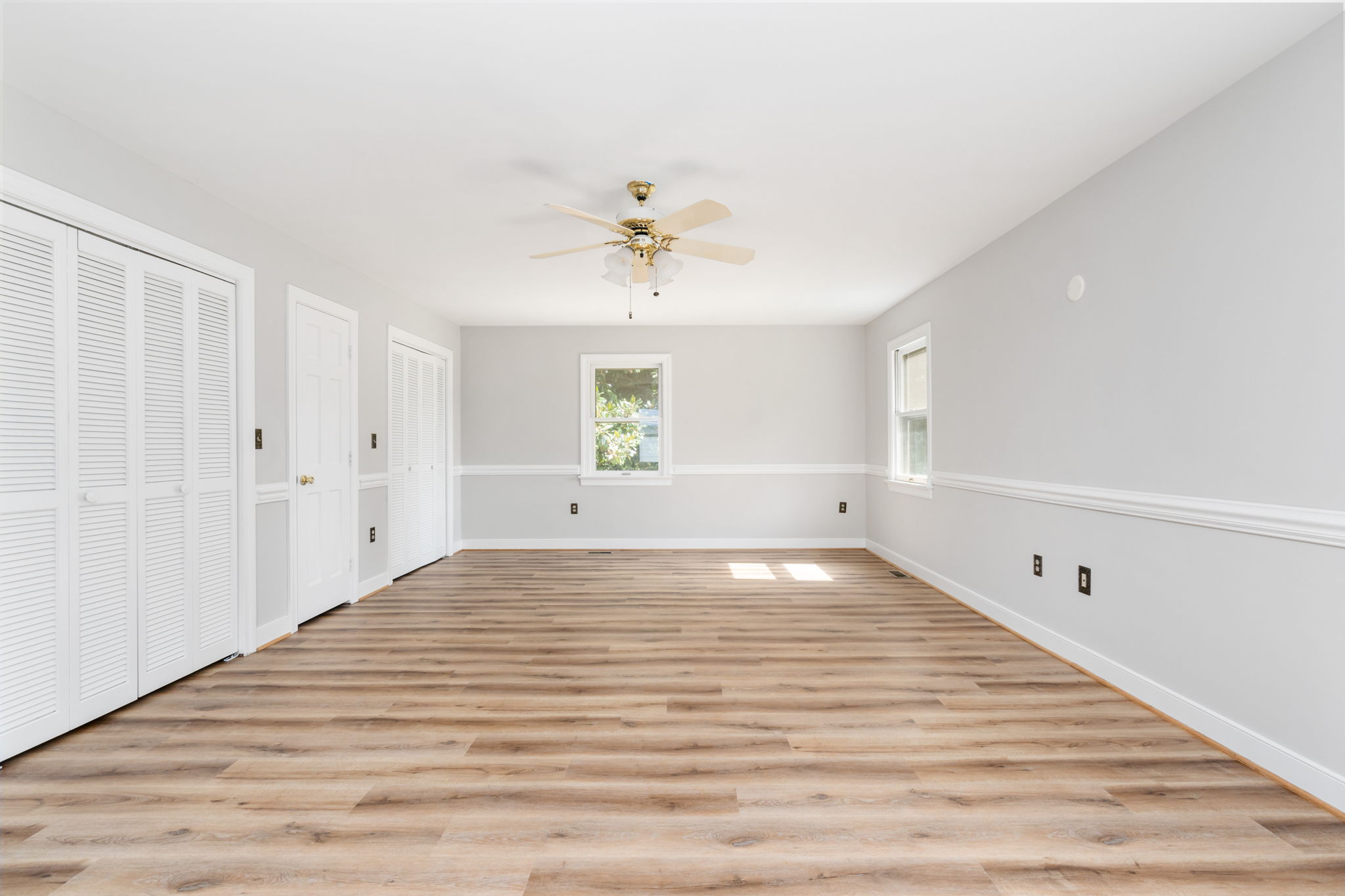 Huge main bedroom with new laminate flooring!