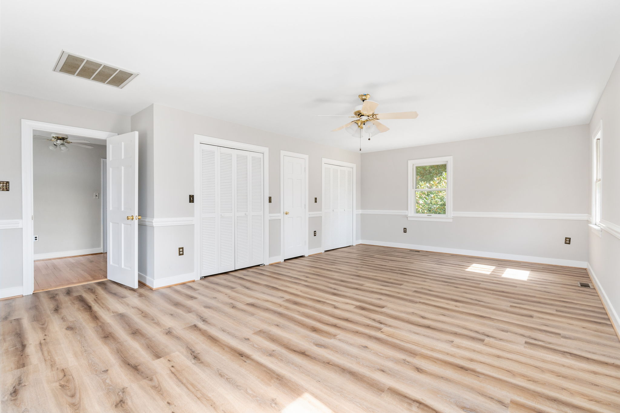 Three closets, ceiling fan, and custom trim!