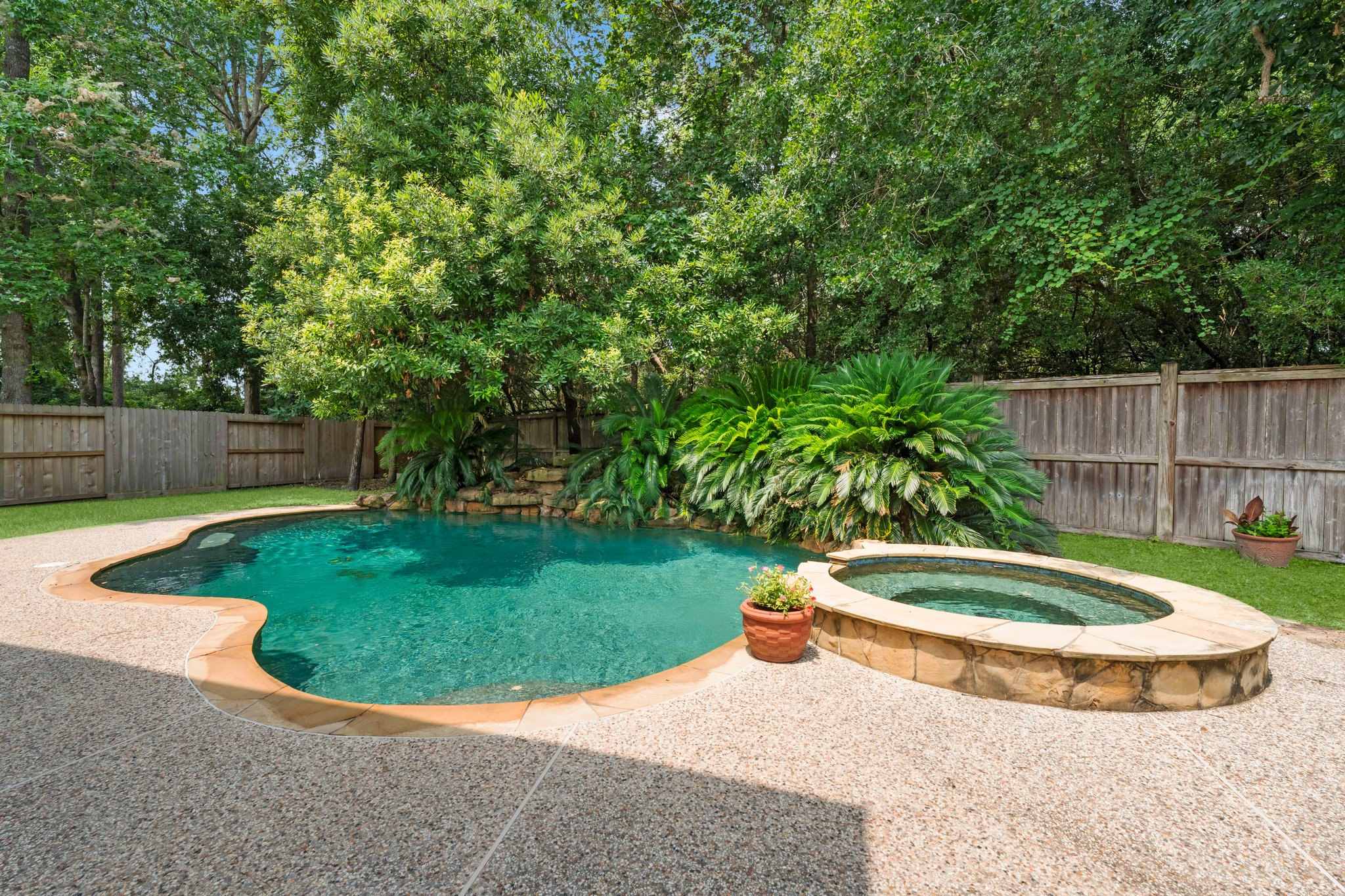 Step out the backdoor into a relaxing and tranquil tree lined backyard.