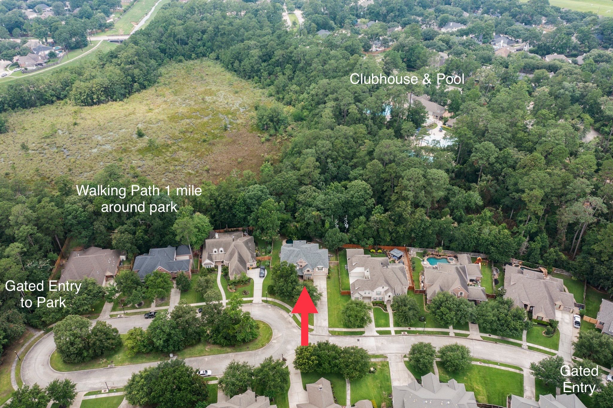 Another aerial view with home location, gated entries, walking path, and clubhouse.