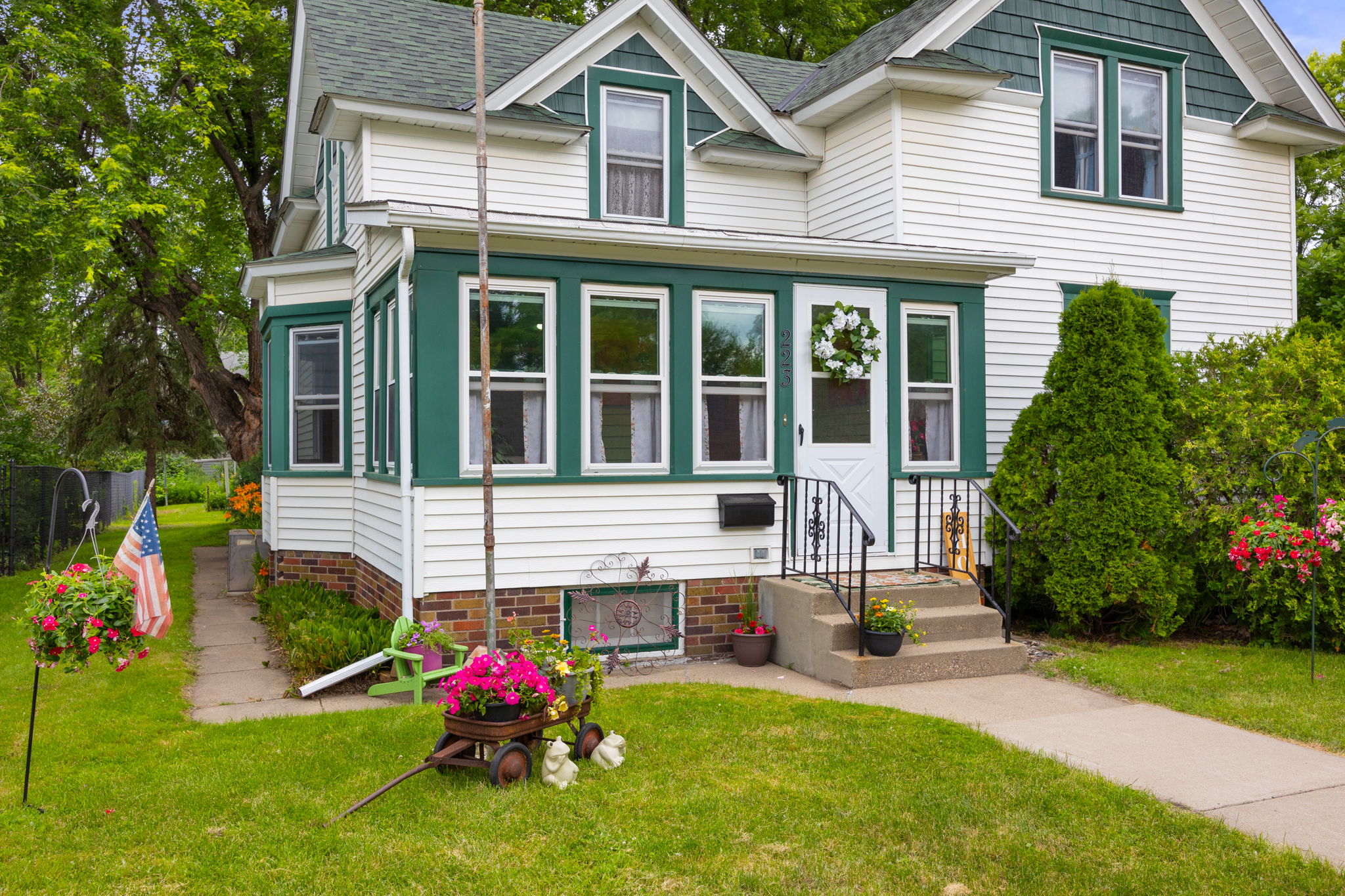 Stately and spacious, this home lives large and sits on a deep corner lot w/ mature oaks and beautiful blvd trees including what looks like a flame amur Maple. Georgeous Boston ferns and day lillys surround the base of the home.