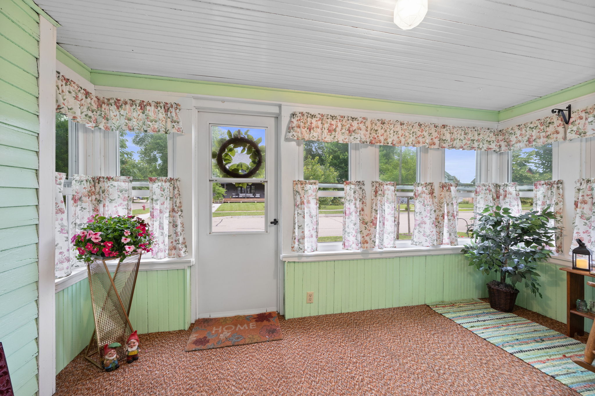 The inviting front porch welcomes you home to this property that exudes character, charm, and pride of ownership.