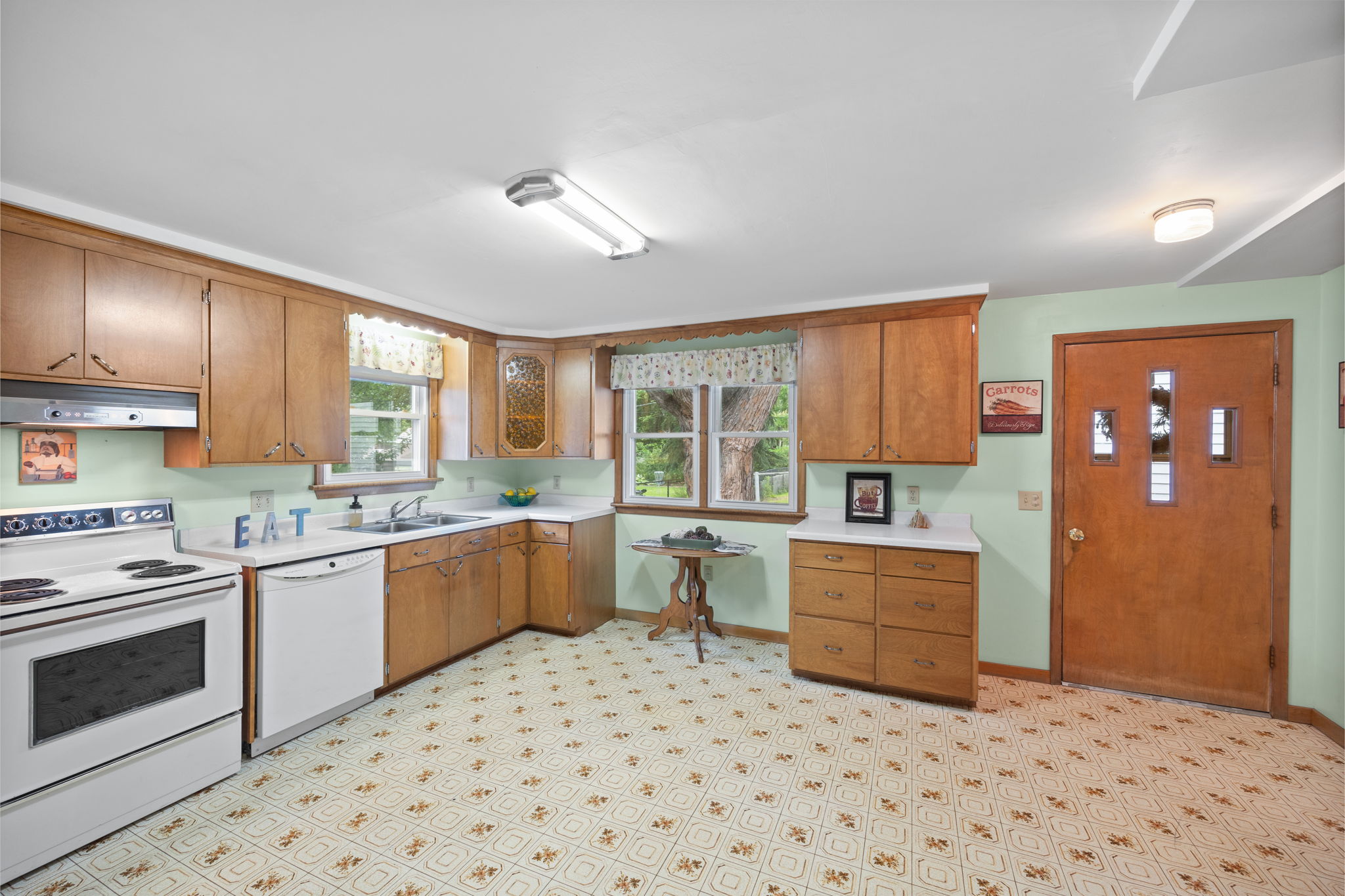 The kitchen offers the perfect spot for a table with a view of the peaceful backyard! Watch cardinals at the bird-feeder and enjoy the wonderful shade of the mature oaks.