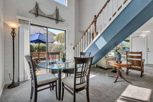 Dining area flows easily between the kitchen, living room, and patio.