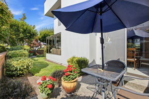 Garden patio and landscaped side yard just off the dining area.