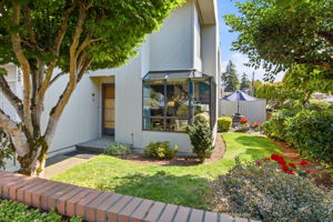 Welcome to this light-filled corner/end unit at Coronado Townhomes!