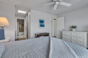 Primary bedroom with direct access to the dressing area and full bath.