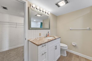 New vanity, tile, toilet, lights