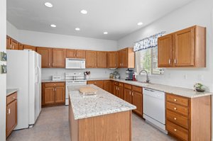 Granite Countertops~ Plenty of Cabinet Space in addition to large Pantry