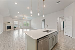 Kitchen view to living  area and fireplace
