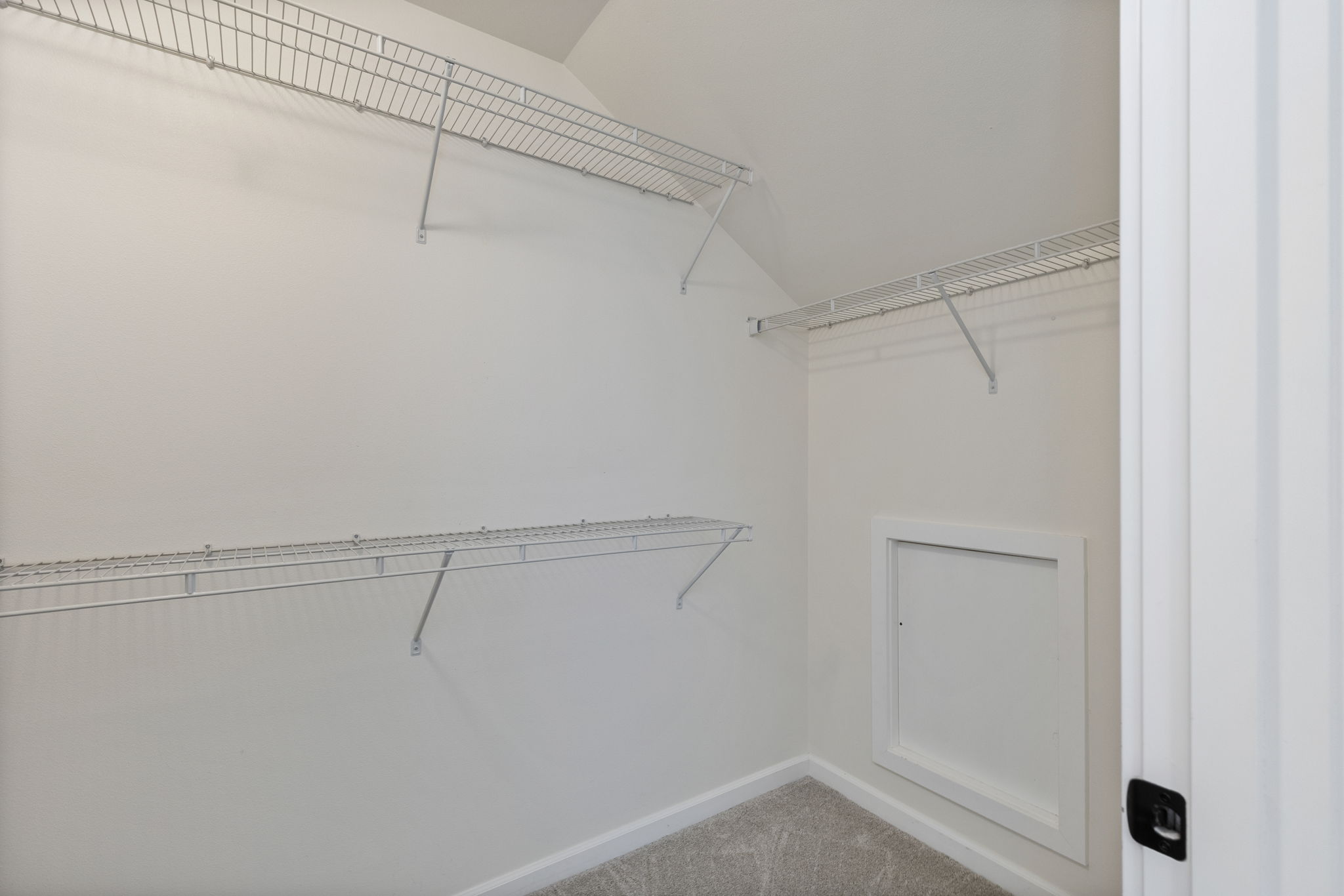Large walk in closet in primary suite.