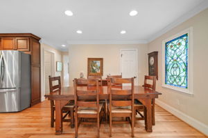 There is a walk in pantry behind that door.  Stained glass does not stay it is an heirloom. Will be removed and casing painted