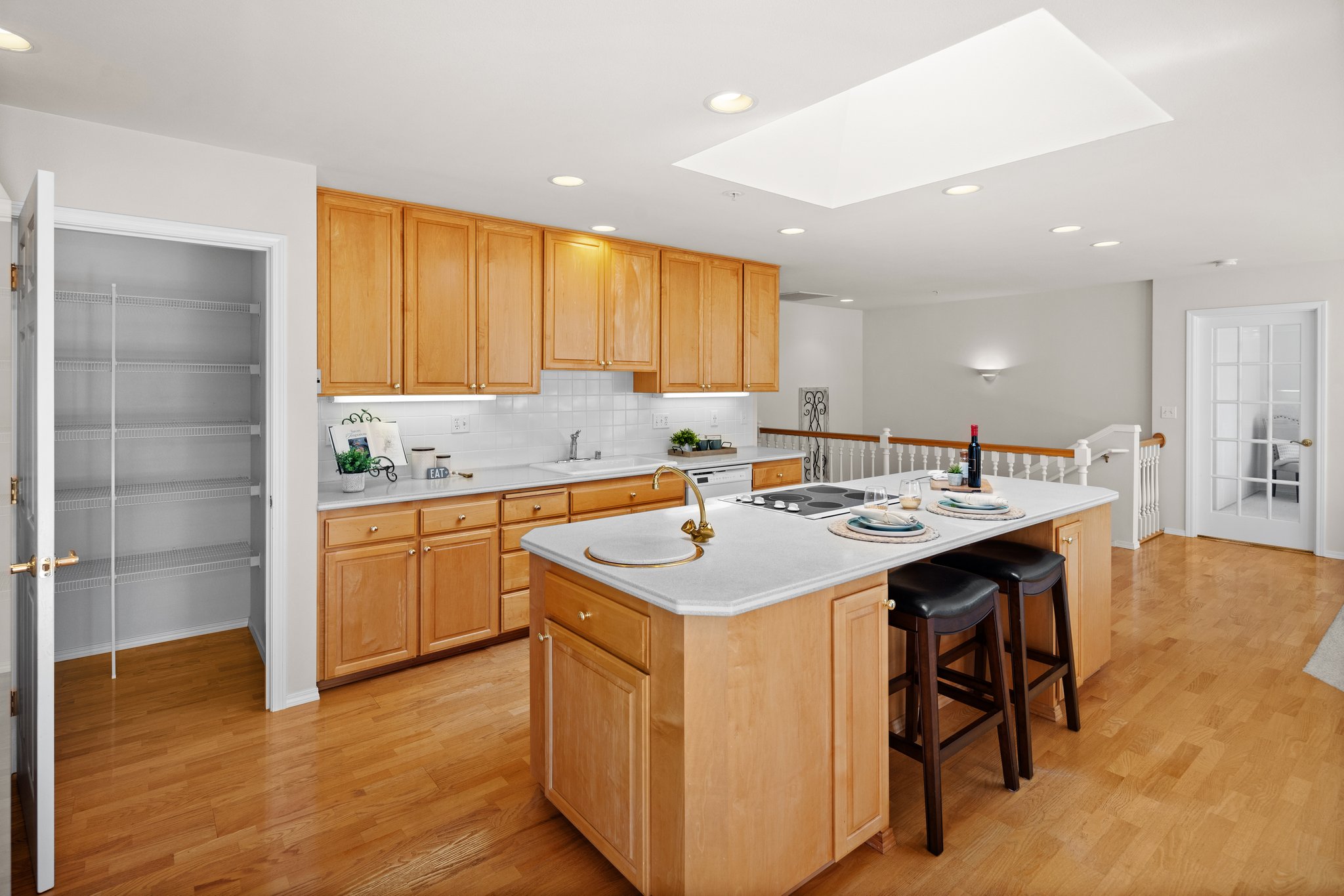 Kitchen features a walk-in pantry and skylight