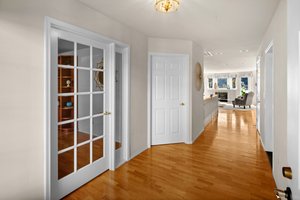 Gleaming hardwoods greet you at the front door